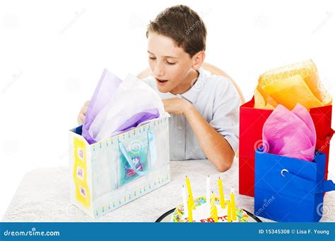 Opening Birthday Presents stock photo. Image of cake - 15345308