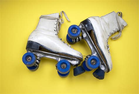 Royalty-Free photo: Pair of white leather roller skates | PickPik