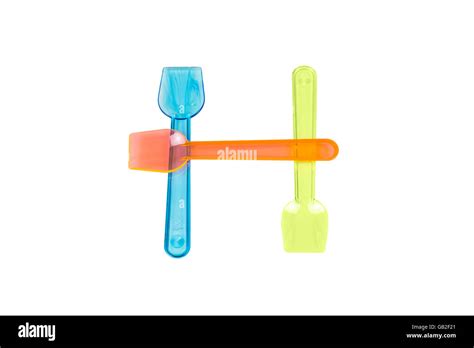H letter with ice cream spoons Stock Photo - Alamy