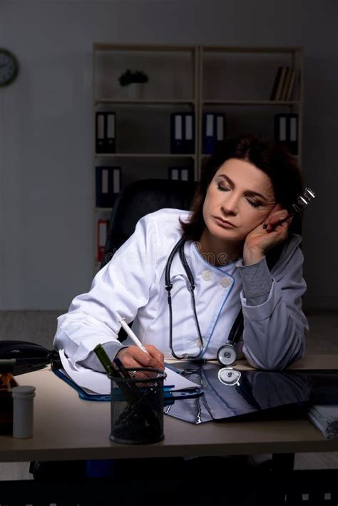 Aged Female Doctor Working at Night Shift Stock Image - Image of evening, fatigue: 149756951