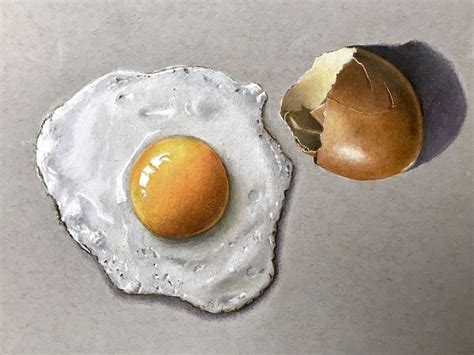 Learn how to create striking realism with coloured pencils as you draw a fried egg and broke ...