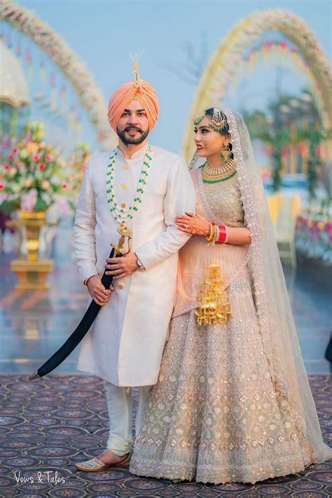 Bride And Groom In Pink And Gold Saree And White Sherwani | Punjabi ...