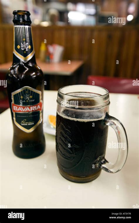 Costa Rica Food and Drink glass of cold Bavaria Dark beer on bar table Stock Photo - Alamy