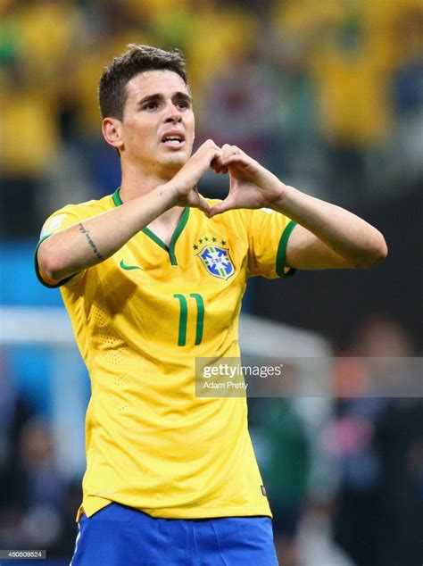 Oscar of Brazil celebrates his goal in the second half during the ...