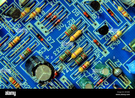 Blue Printed Circuit Board with resistors, capacitor and transistors Stock Photo, Royalty Free ...