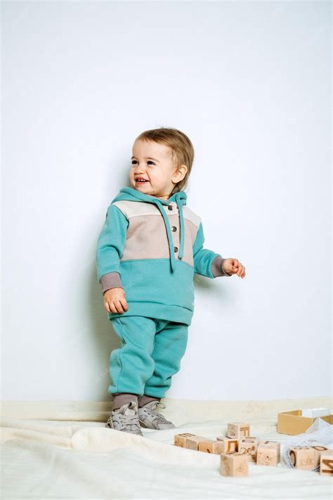 Premium Photo | Baby fashion unisex clothes for babies cute baby in cotton set suit on light ...