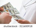 Doctor Holding Money Free Stock Photo - Public Domain Pictures