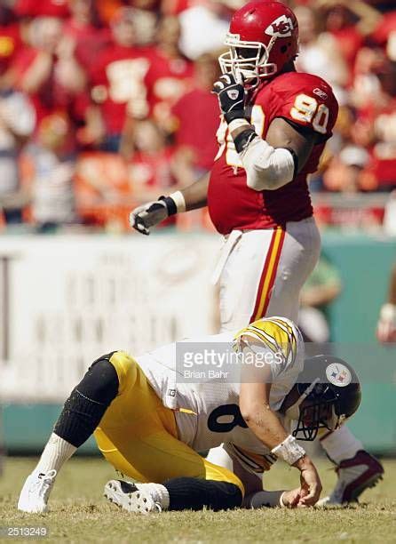 Quarterback Tommy Maddox of the Pittsburgh Steelers gets up slowly ...