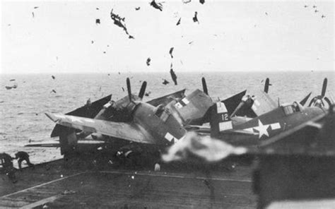 Check out this dramatic photo of an F6F smashing into 6 other parked Hellcats with pilots aboard ...