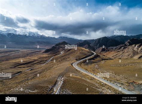 aerial view of the curved Qilian mountain road Stock Photo - Alamy