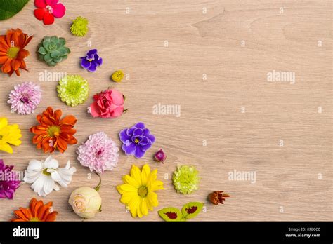 Flowers on wooden table Stock Photo - Alamy