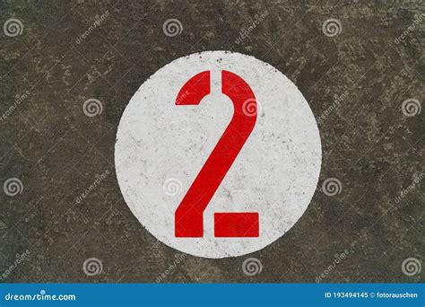 Red Number Two Inside White Circle Painted on Concrete Stock Image - Image of color, ground ...