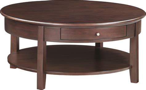 McKenzie Round Cocktail Table with Shelf | Sadler's Home Furnishings | Cocktail/Coffee Tables