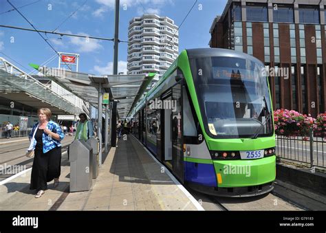 A Tramlink tram stops at East Croydon station in Croydon, Surrey Stock Photo - Alamy