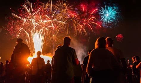 People Standing In Front Of Colorful Firework Stock Photo - Download Image Now - iStock