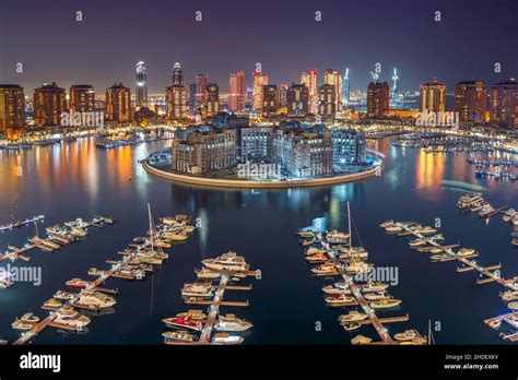 The Pearl Qatar Marina, expensive yachts in Doha bay, Qatar Stock Photo ...