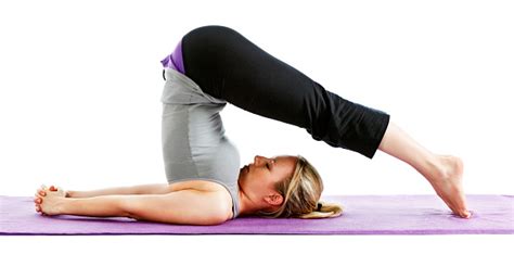 Woman Demonstrating Halasana Yoga Pose Stock Photo - Download Image Now - iStock