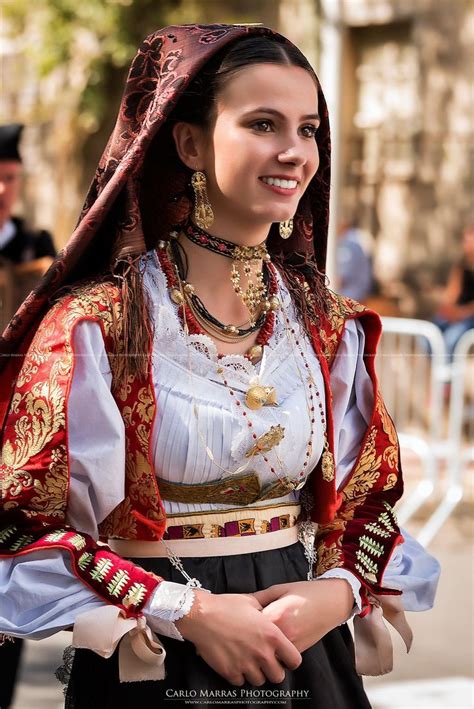 I believe this is a woman in traditional Sardinian costume, please ...