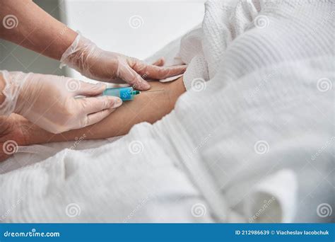 Female Doctor Making Injection in Patient Arm Stock Image - Image of treatment, medicine: 212986639