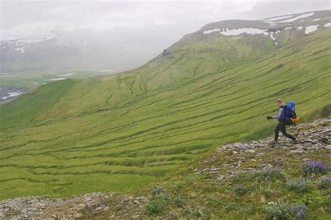 A woman hiking on Umnak Island in the … – License image – 70501177 lookphotos