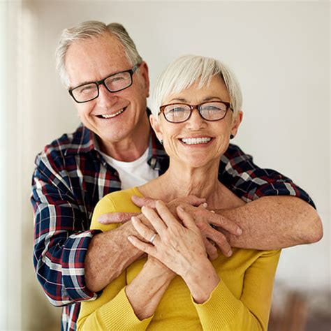 Elderly-couple-smiling-and-hugging - Confident Smiles Family Dentistry