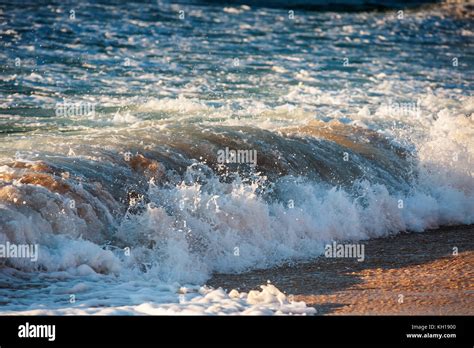 Beautiful sunrise wave Stock Photo - Alamy