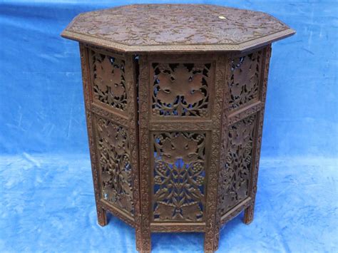 Lot - ANGLO INDIAN CARVED FOLDING HEXAGONAL TOP COFFEE TABLE, MEASURES 60CM H X 61CM X 61CM