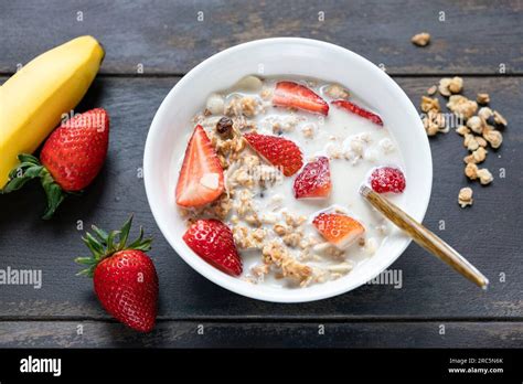 Breakfast granola cereals bowl with oat milk and strawberries. Healthy ...