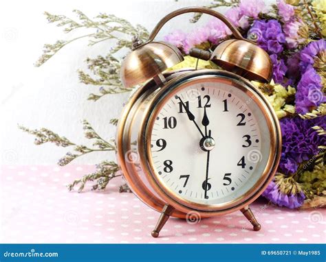 Spring Time with Alarm Clock and Statice Flowers Bouquet Background Stock Image - Image of ...