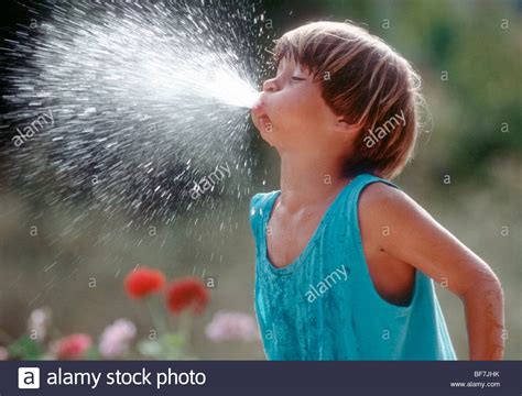 A boy is spitting with water Stock Photo: 26598479 - Alamy