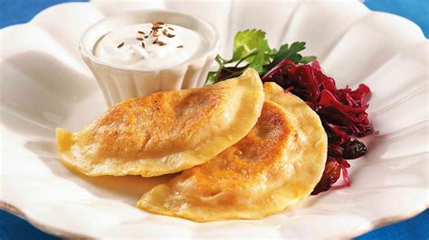 Sweet Potato Pierogi With Braised Red Cabbage and Caraway Sour Cream | Plate