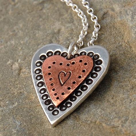 handmade copper and silver heart necklace by alison moore designs | notonthehighstreet.com