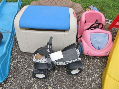 (1) 2 Step Slide, (2) Kids riding cars, (1) Rectangular sandbox with lid, (1) Large slide, (1 ...