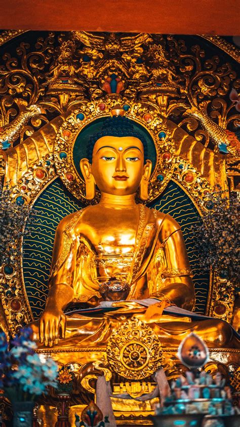 Download A Golden Buddha Statue Wallpaper | Wallpapers.com
