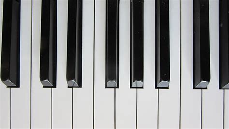 Royalty-Free photo: White and black piano keyboard | PickPik