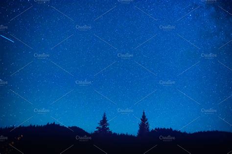 Dark blue night sky above forest ~ Nature Photos ~ Creative Market