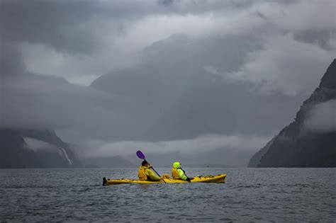 Kayaking Milford Sound in the pouring rain - Young Adventuress