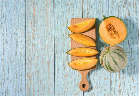 Sliced Ripe Cantaloupe Melon on a Blue Wooden Table, Top View Stock Photo - Image of nature ...