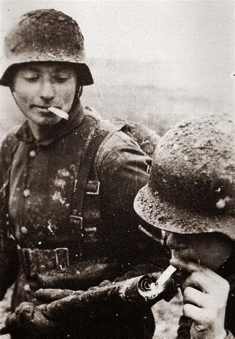 German soldier lighting his cigarette with a flamethrower, 1917 - Rare Historical Photos