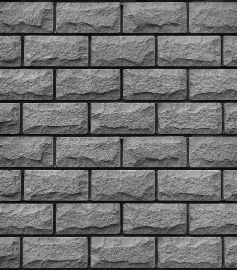 a black and white photo of a wall made out of stone blocks with no mortars