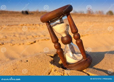 Hourglass on sand stock photo. Image of arid, concepts - 43721576