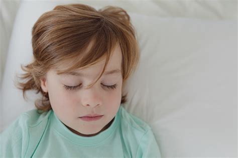 Boy Sleeping In Bed In Bedroom Stock Photo - Download Image Now ...