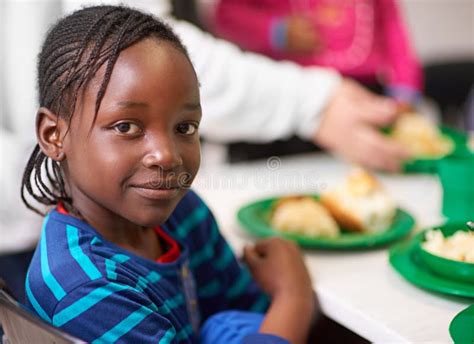 No Child Should Be Hungry. Portrait of a Little Girl Sitting at a Dining Table with Food ...