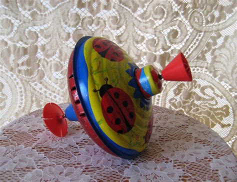 Vintage metal spinning top vintage tin toy collectible made