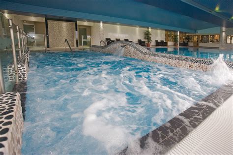 Superb saline hydrotherapy pool with powerful water jets and loungers beneath the water level ...