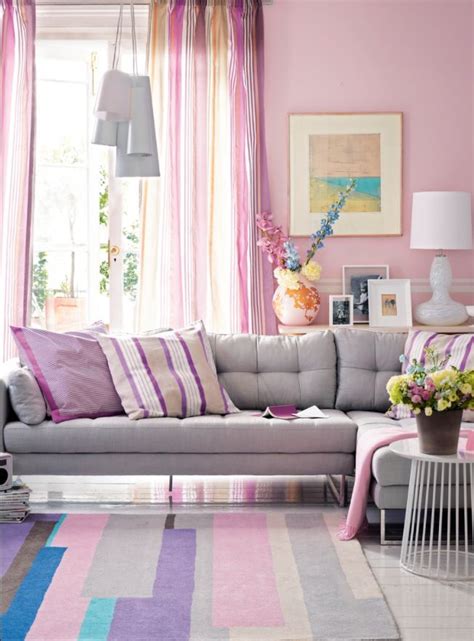 Team light-filtering striped curtains with shell pink walls and a dove grey sofa to cre ...