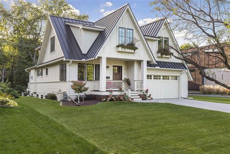 a large white house with a black roof