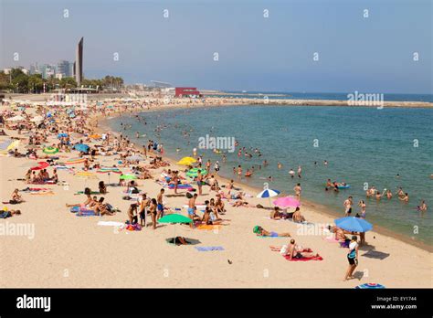 Tourists and local people on Platja Nova Icaria ( Nova Icaria beach Stock Photo, Royalty Free ...