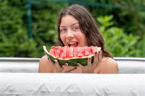 Gorgeous Woman with Long, Dark Hair and Watermelon in the Garden Inflatable Pool Stock Image ...