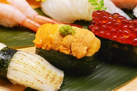 Premium Photo | Close up uni, salmon roe sushi, japanese food